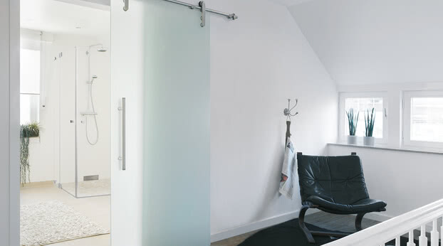 Sliding door system Motion 200 as a bathroom door with motif Ravensburg