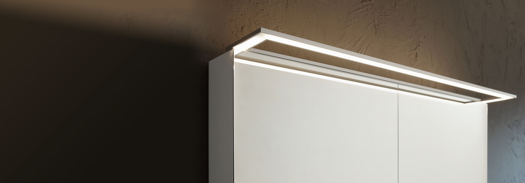 External lighting for mirror cabinet