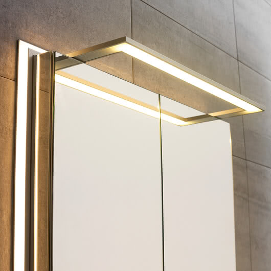 External lighting for mirror cabinets