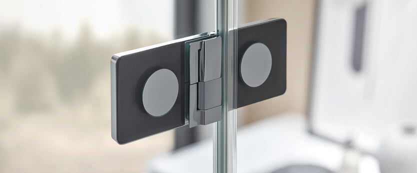 The hinge cover slides sideways over the turning mechanism