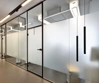 Treatment rooms of a dental office with Aluzarge 100 black framed